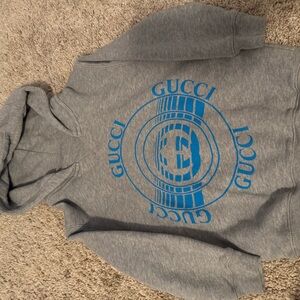 Authentic used once Gucci Heather Gray Sweater with Blue Emblem